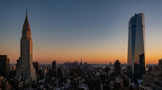 Split perspective of the New York City skyline contrasting a modern glass observation tower with a classic Art Deco skyscraper at dusk