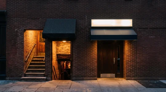Two contrasting entrances symbolizing the choice between an intimate basement jazz club and a polished uptown jazz venue in New York City